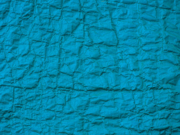Blue plastic wrinkled texture. Abstract texture, plastic bag for background Blue plastic wrinkled texture. Abstract texture, plastic bag for background knobby knees stock pictures, royalty-free photos & images