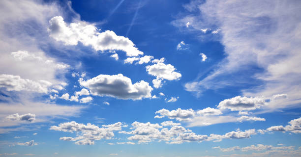 Blue sky and clouds background stock photo