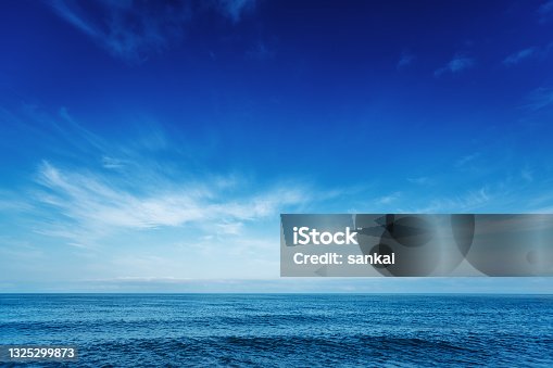 istock Blue sky over the sea 1325299873