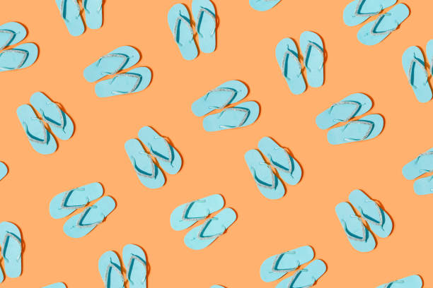 Blue slippers Blue slippers seamless pattern on orange background flip flop stock pictures, royalty-free photos & images