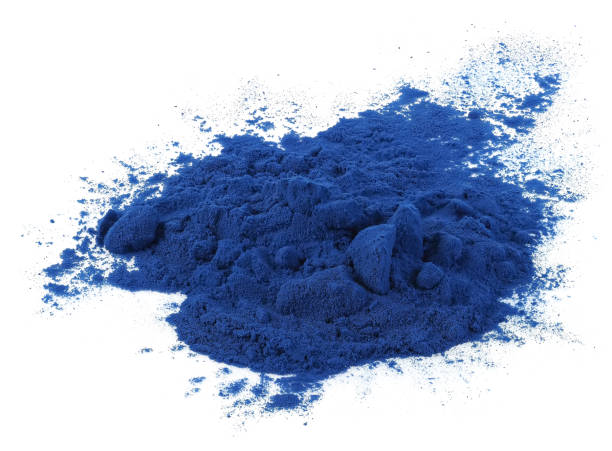 Blue spirulina powder isolated on white background stock photo
