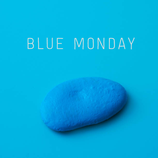 синий камень и текст синий понедельник - blue monday стоковые фото и изображения
