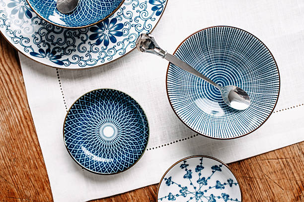 blue table ware plates and bowls overhead - skål porslin bildbanksfoton och bilder