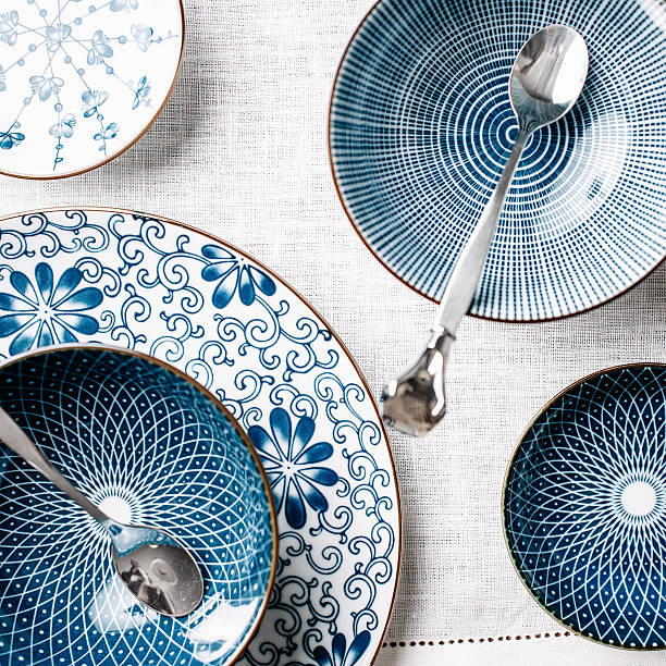 Blue table ware plates and bowls overhead stock photo