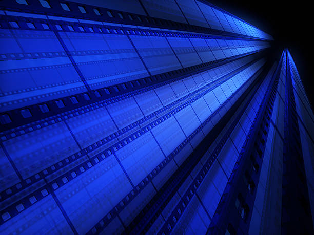 A blue tinted image of cinefilm as a background stock photo