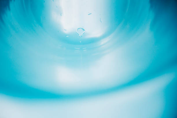 Blue water slide with water drops stock photo