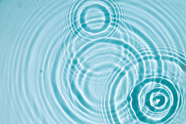 Blue water texture, blue mint water surface with rings and ripples. Spa concept background. Flat lay, copy space. stock photo