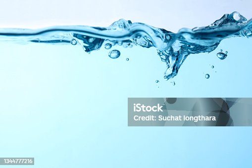 istock blue waves underwater and Bubbles 1344777216
