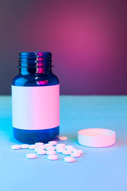 blue white label medication bottle with loose pills, mockup blue white label medication bottle with loose pills, mockup xanax pills stock pictures, royalty-free photos & images