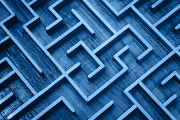 Blue wooden labyrinth maze puzzle close up Close up of blue toned wooden labyrinth maze, classic toy puzzle game, elevated high angle view challenge stock pictures, royalty-free photos & images