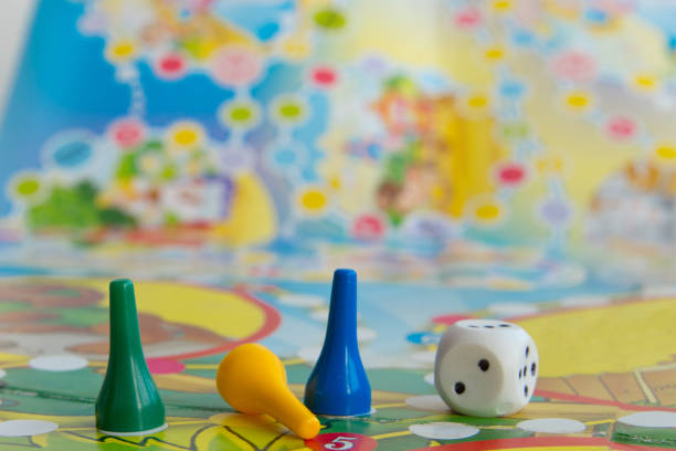Blue, yellow and green plastic chips, dice and Board games for children .  selective focus stock photo
