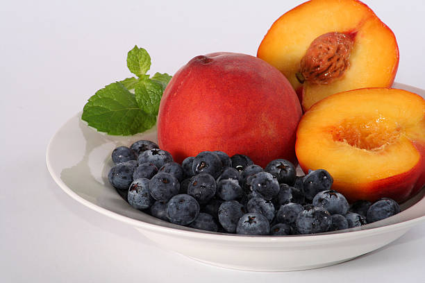 blueberry and peach bowl stock photo