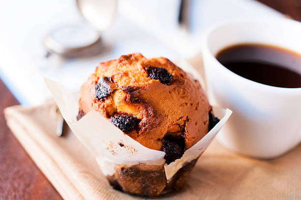 Blueberry muffin with coffee in a white mug stock photo