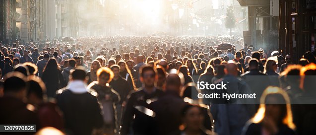 istock Blurred crowd of unrecognizable at the street 1207970825