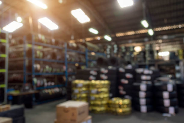 Blurred image of Tire storage in wholesale store, new tires for sale. Blurred image of Tire storage in wholesale store, new tires for sale. tire vehicle part stock pictures, royalty-free photos & images