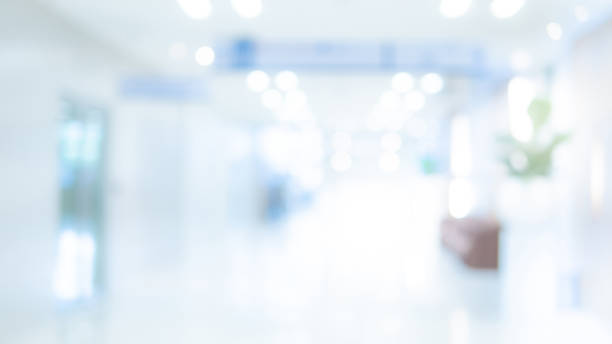Blurred luxury hospital interior background Abstract blur luxury hospital hall. Blur clinic corridor interior background with defocused effect. Healthcare and medical concept hospital ward photos stock pictures, royalty-free photos & images