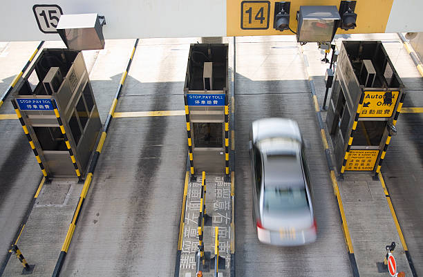 A blurred motion photograph of toll booths stock photo