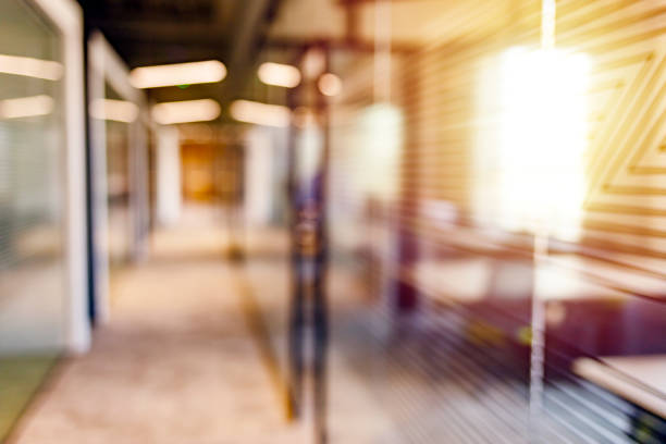 Blurred office background Blur abstract background from building office hallway (corridor). focus on foreground stock pictures, royalty-free photos & images