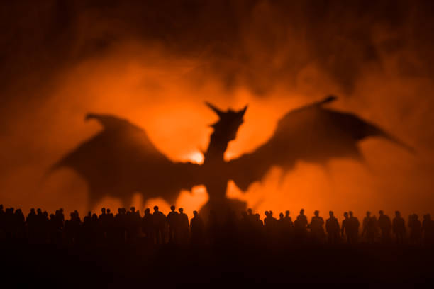 Blurred silhouette of giant monster prepare attack crowd during night. Selective focus. Decoration Blurred silhouette of giant monster prepare attack crowd during night. Selective focus. dragon photos stock pictures, royalty-free photos & images