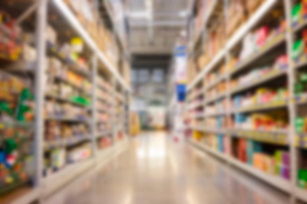 Blurred supermarket Empty Supermarket aisle shelves abstract blur defocused business background market retail space photos stock pictures, royalty-free photos & images