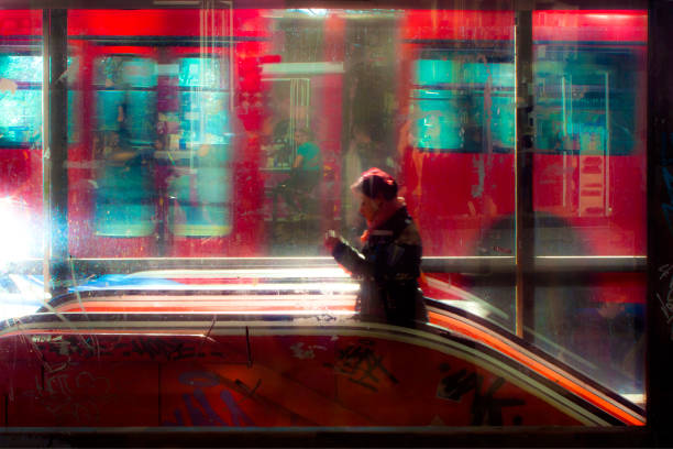 wazig jonge vrouw lopen van de metro-ingang - subway snapshot stockfoto's en -beelden