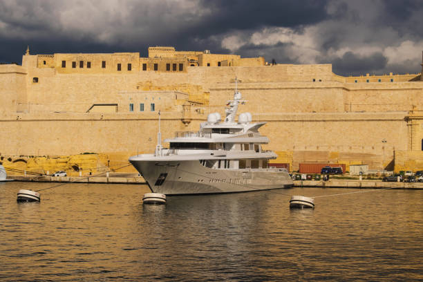 Boat docked in the port in Malta stock photo