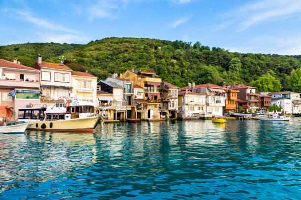 Boats and houses at Anadolu Kavagi village seaside stock photo