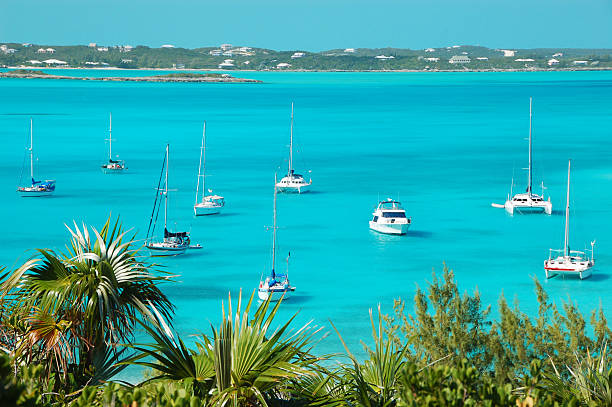 Boats at anchor, Stocking Island, Bahamas stock photo