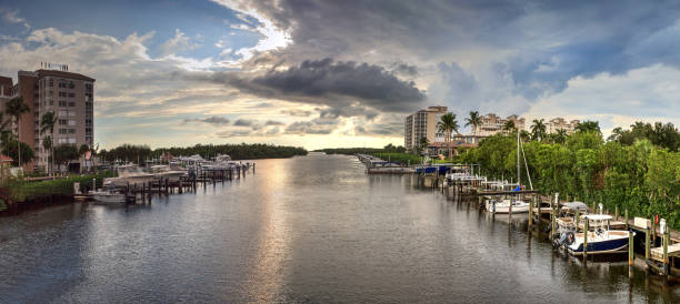 Boats docked in a harbor along the Cocohatchee River in Bonita Springs stock photo