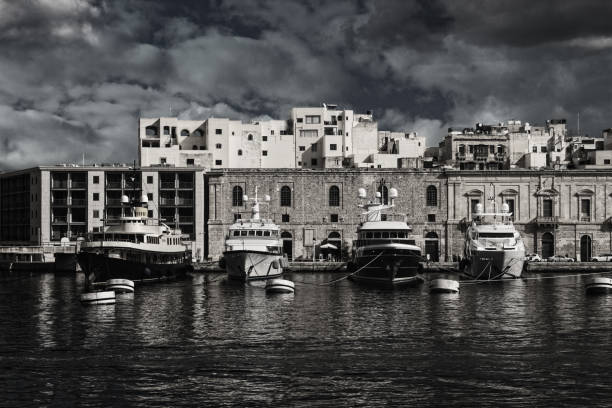 Boats docked in the harbor in Malta stock photo