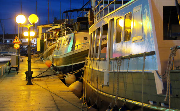 Boats on pier in Trogir, Croatia stock photo