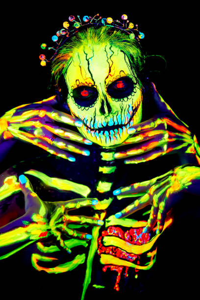 UV body art painting of helloween female skeleton stock photo