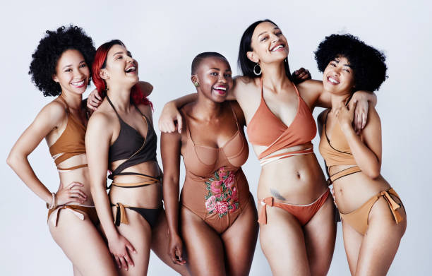 Body positivity - Embrace your body, baby! Studio shot of a group of beautiful young women in posing together in swimwear against a gray background beautiful voluptuous women stock pictures, royalty-free photos & images