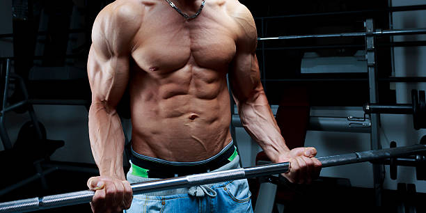 Bodybuilders top body lifting bar stock photo