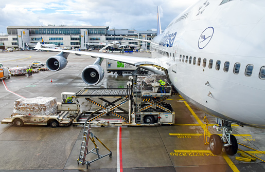 Frankfurt, Germany - February 12, 2018: View from the departure gate at Frankfurt Airport (FRA) onto a Boeing 747 aircraft of Lufthansa, which is being prepared for departure to Dubai.