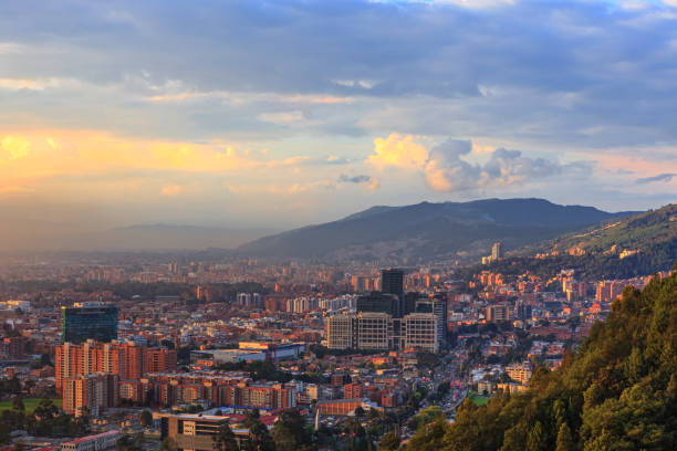 Bogota, Colombia - High Angle Panoramic View Of The Andean Capital City From The Heights Of La Calera On The Andes At Sunset Time stock photo