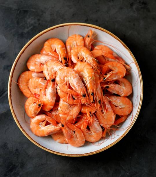 Boiled big sea prawns (shrimps). Healthy food. Top view. Copy space. stock photo