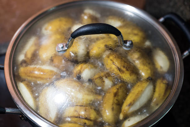 Boiling banana in hot pot stock photo