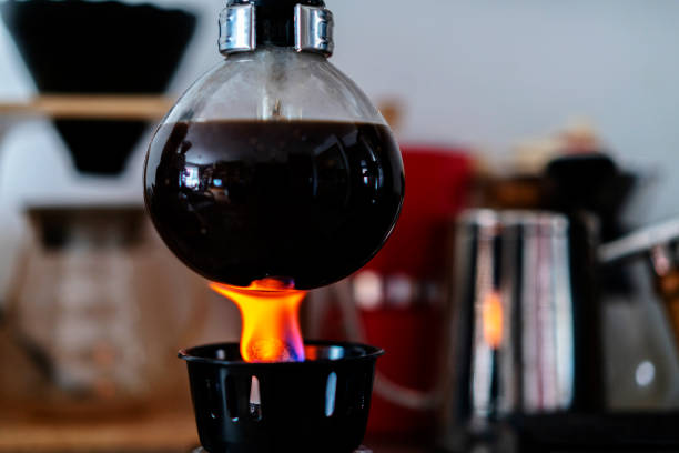 boiling coffee with siphon coffee pot stock photo