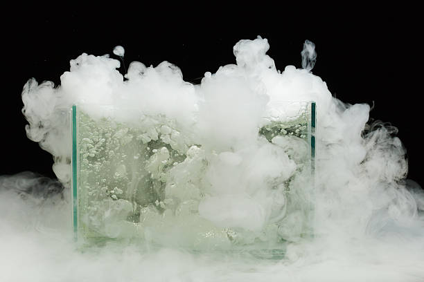 boiling dry ice with vapor boiling dry ice with huge amount of vapor chemical reaction stock pictures, royalty-free photos & images