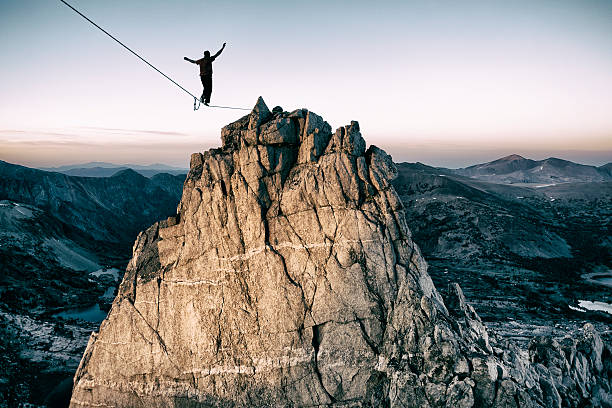 bold Slackline high in the mountains concentration photos stock pictures, royalty-free photos & images
