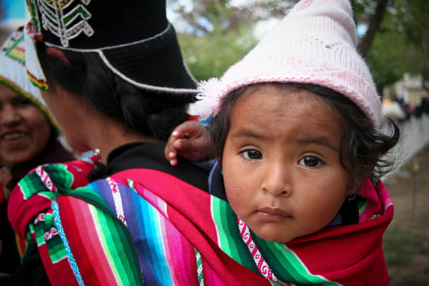 Bolivian Woman Carrying Her Baby stock photo