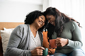 istock Bonding moment between mother and daughter at home 1345979358