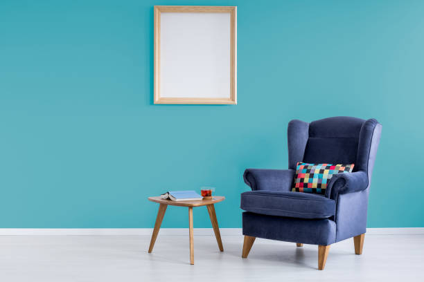 Cobalt blue seat on a teal coloured background