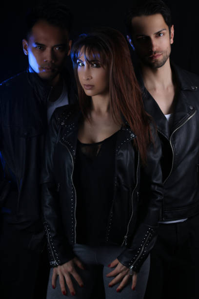 Book cover for a vampire novel - three attractive vampires three attractive vampires over a dark background romance book cover stock pictures, royalty-free photos & images