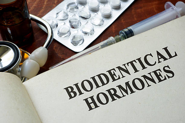 Book with words bioidentical hormones on a table.  hormone stock pictures, royalty-free photos & images