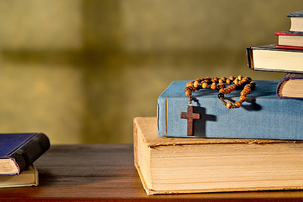 Books And Rosary taken under studio light with electronic flash catholicism stock pictures, royalty-free photos & images