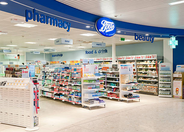 Boots Shop Entrance Edinburgh, Scotland, UK - January 14, 2011: The entrance to a Boots pharmacy and beauty shop in Edinburgh Airport. boot stock pictures, royalty-free photos & images
