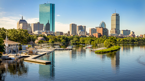 View of the American city of Boston in Massachusetts, USA at Government Center by the Longfellow bridge showcasing its mix of contemporary and historic buildings by the Charles River on a sunny day.