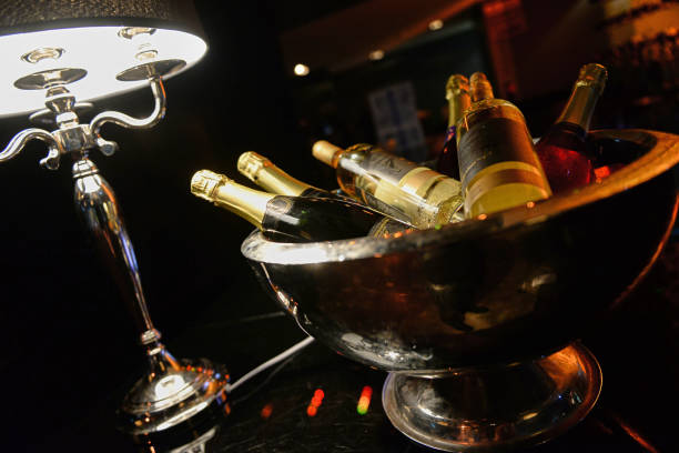 Bottle of champagne in bucket of ice. stock photo